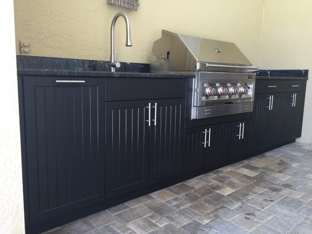 backyard grill with brown cabinets